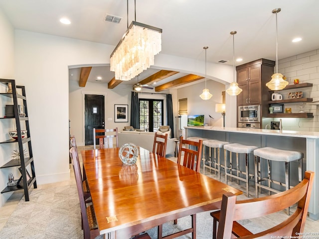 dining room featuring baseboards, visible vents, recessed lighting, and beam ceiling