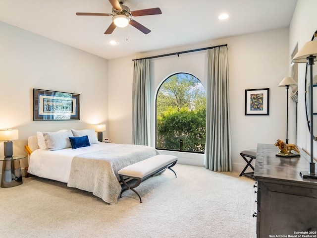 carpeted bedroom featuring recessed lighting and a ceiling fan