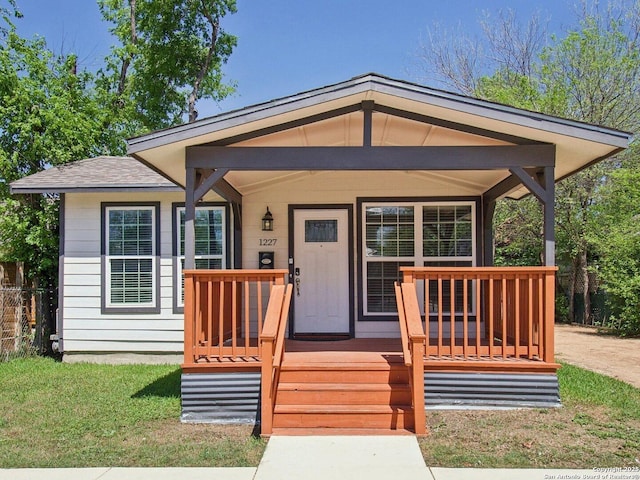 view of front of house featuring a front lawn and a porch