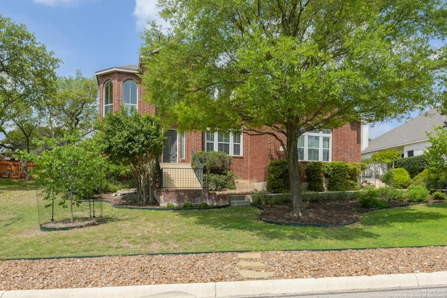 7609 Highland Park, San Antonio, TX 78250 - obstructed view of property with brick siding and a front lawn