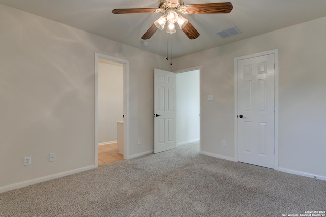 7609 Highland Park, San Antonio, TX 78250 - unfurnished bedroom with carpet flooring, baseboards, and a ceiling fan