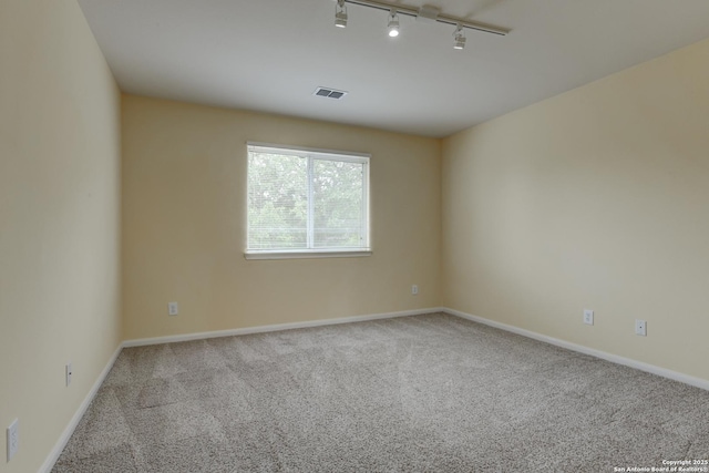 7609 Highland Park, San Antonio, TX 78250 - spare room with track lighting, carpet, and baseboards