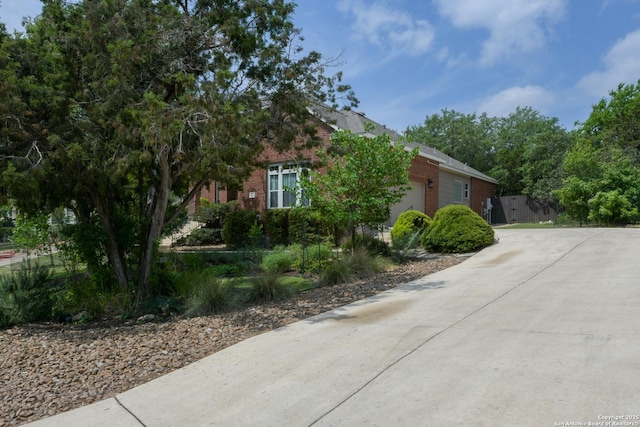 7609 Highland Park, San Antonio, TX 78250 - view of front of property featuring brick siding, a garage, and driveway