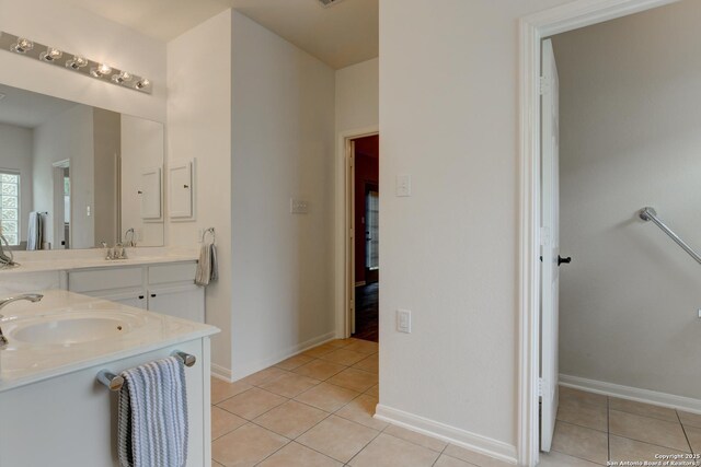 7609 Highland Park, San Antonio, TX 78250 - full bathroom featuring tile patterned floors, double vanity, and baseboards