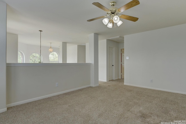 7609 Highland Park, San Antonio, TX 78250 - carpeted spare room with attic access, a ceiling fan, and baseboards
