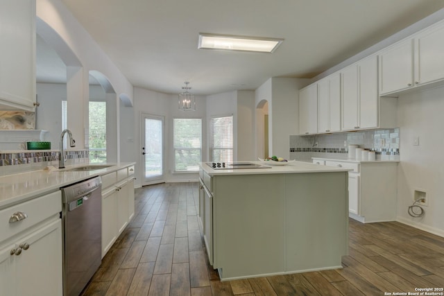7609 Highland Park, San Antonio, TX 78250 - kitchen featuring a sink, dishwasher, arched walkways, dark wood-style floors, and backsplash