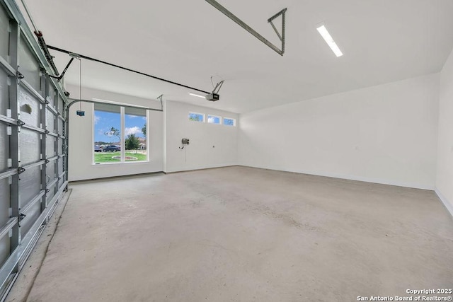 303 Pleasant Knl, San Antonio, TX 78260 - garage with a garage door opener and baseboards