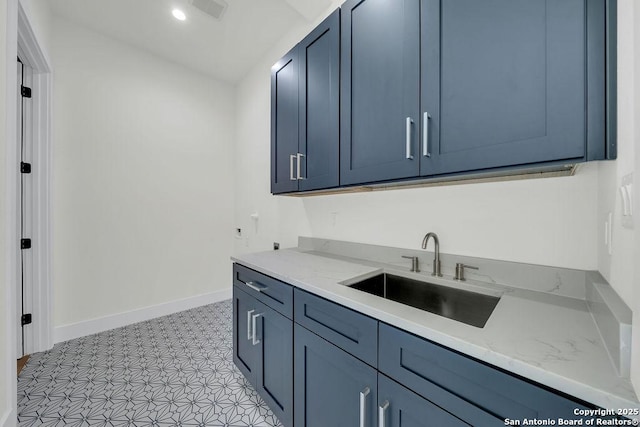 303 Pleasant Knl, San Antonio, TX 78260 - laundry area with baseboards, recessed lighting, and cabinet space