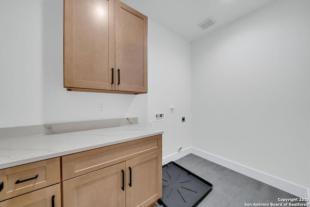 303 Pleasant Knl, San Antonio, TX 78260 - laundry room with electric dryer hookup, hookup for a washing machine, cabinet space, and baseboards