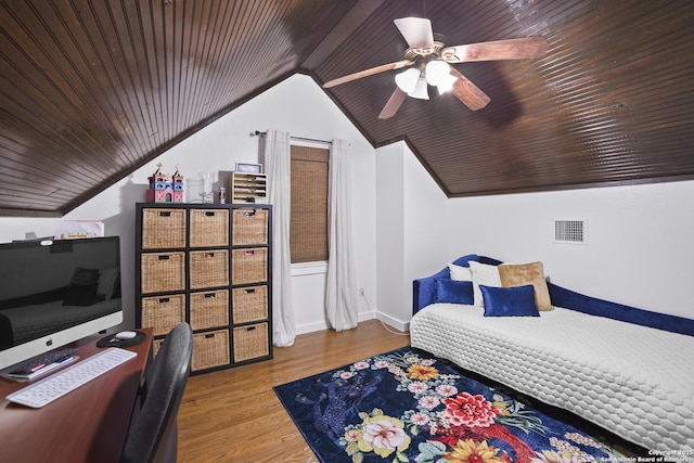 bedroom featuring lofted ceiling, visible vents, wood finished floors, and ceiling fan