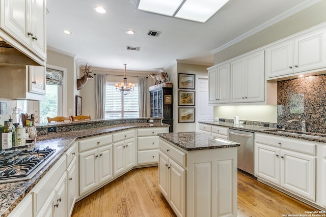 93 Bristol Grn, San Antonio, TX 78209 - kitchen with ornamental molding, appliances with stainless steel finishes, a sink, and visible vents