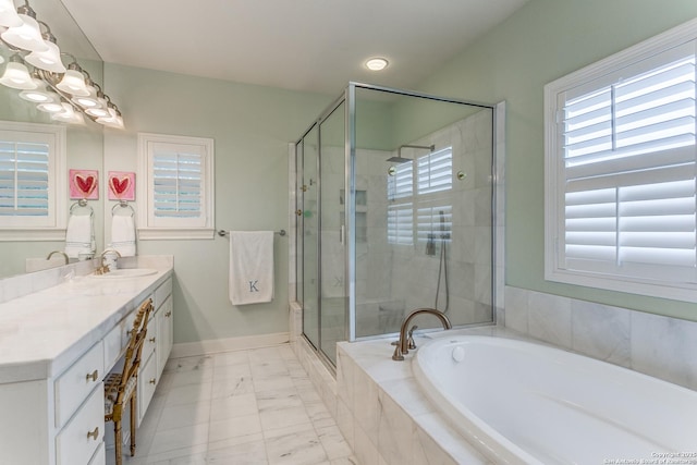 93 Bristol Grn, San Antonio, TX 78209 - bathroom featuring a shower stall, marble finish floor, vanity, baseboards, and a garden tub
