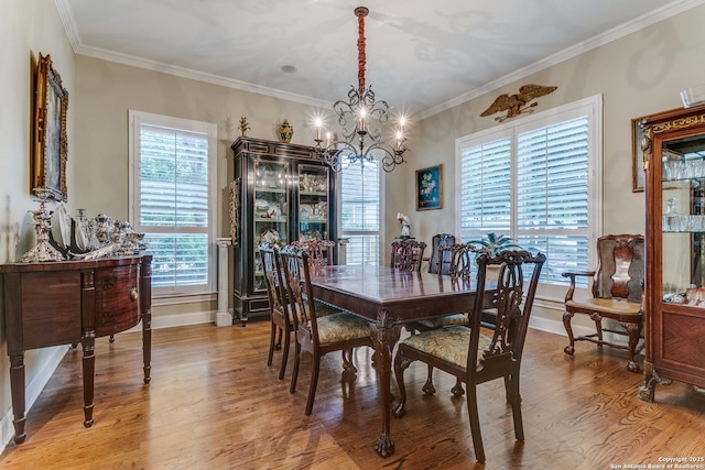 93 Bristol Grn, San Antonio, TX 78209 - dining area featuring ornamental molding, baseboards, a notable chandelier, and light wood-type flooring