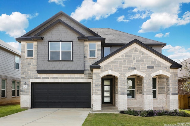5230 Anzueto, San Antonio, TX 78261 - view of front facade featuring stone siding, a garage, and concrete driveway