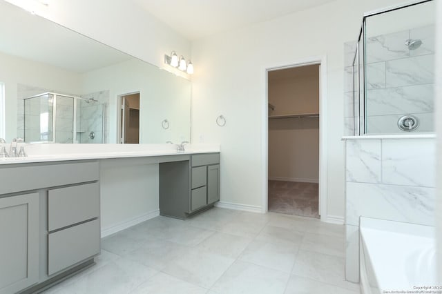 5230 Anzueto, San Antonio, TX 78261 - bathroom with a spacious closet, vanity, baseboards, and a shower stall