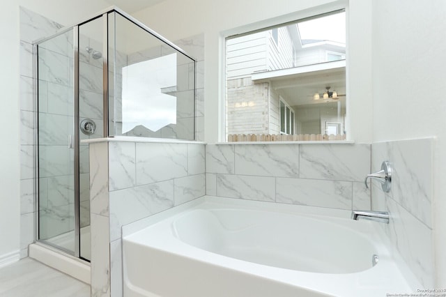 5230 Anzueto, San Antonio, TX 78261 - full bath with a stall shower, a skylight, and a bath