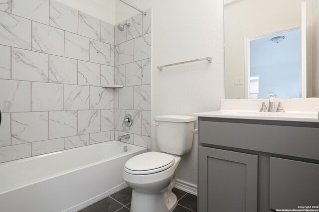 5230 Anzueto, San Antonio, TX 78261 - full bath featuring toilet, vanity, tile patterned floors, and washtub / shower combination