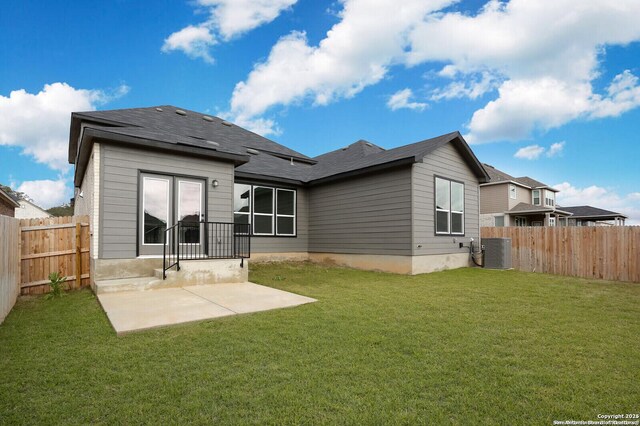 5230 Anzueto, San Antonio, TX 78261 - back of property featuring a fenced backyard, a lawn, central air condition unit, and a patio area