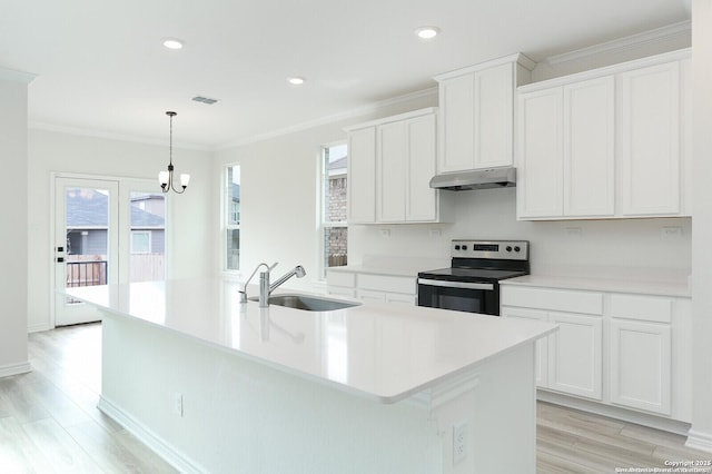 5230 Anzueto, San Antonio, TX 78261 - kitchen featuring crown molding, a sink, under cabinet range hood, a kitchen island with sink, and stainless steel electric stove