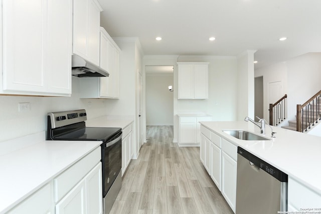5230 Anzueto, San Antonio, TX 78261 - kitchen with white cabinetry, a sink, stainless steel appliances, and under cabinet range hood