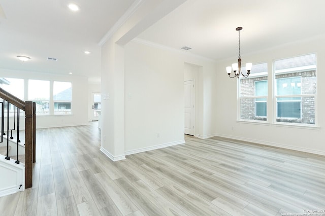5230 Anzueto, San Antonio, TX 78261 - unfurnished room featuring crown molding, stairway, a chandelier, light wood-type flooring, and visible vents