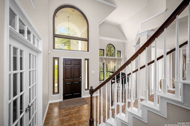 162 Teal Rdg, Canyon Lake, TX 78133 - entryway featuring baseboards, a towering ceiling, french doors, and stairway