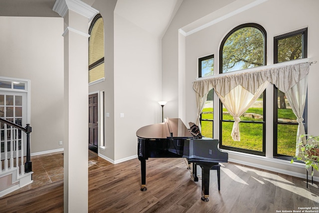 162 Teal Rdg, Canyon Lake, TX 78133 - sitting room featuring baseboards, stairs, high vaulted ceiling, and wood finished floors