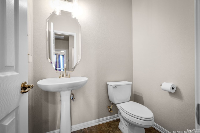162 Teal Rdg, Canyon Lake, TX 78133 - half bathroom with baseboards, visible vents, and toilet
