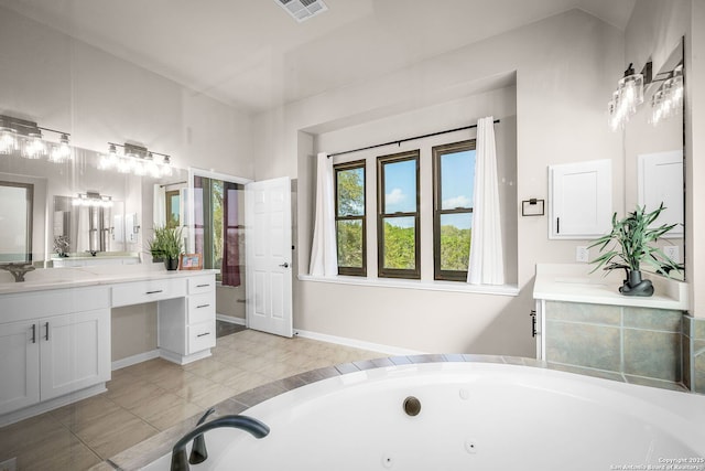 162 Teal Rdg, Canyon Lake, TX 78133 - full bath with a tub with jets, vanity, and visible vents