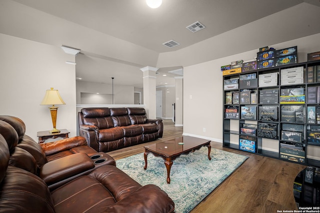162 Teal Rdg, Canyon Lake, TX 78133 - living room with baseboards, visible vents, wood finished floors, and ornate columns