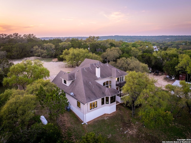 162 Teal Rdg, Canyon Lake, TX 78133 - aerial view at dusk featuring a view of trees