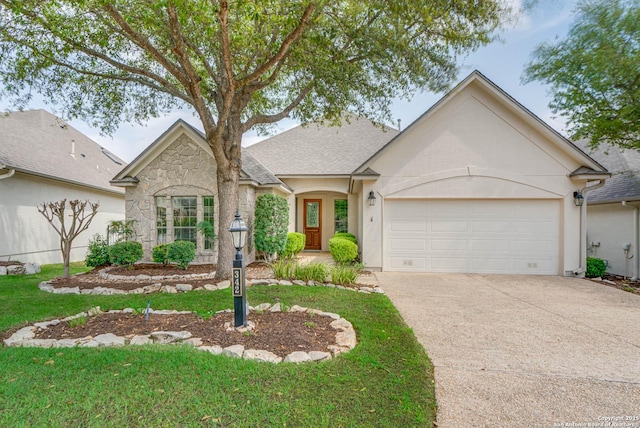 view of front facade featuring stone siding, a garage, concrete driveway, a front lawn, and roof with shingles