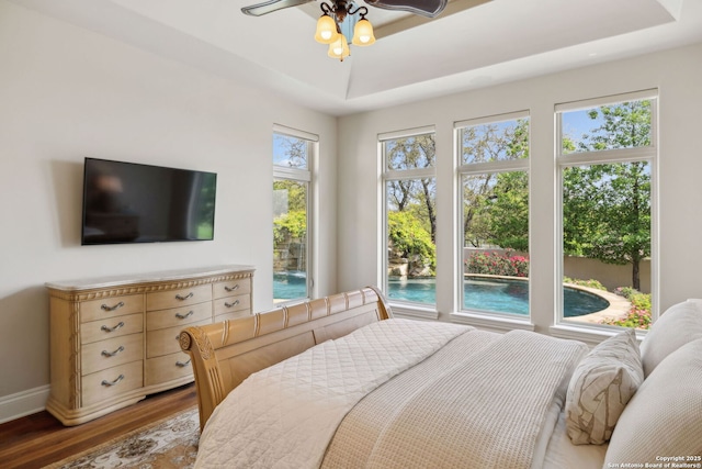 3919 El Chamizal, San Antonio, TX 78261 - bedroom with baseboards, wood finished floors, and a raised ceiling