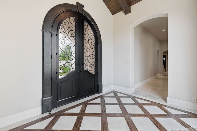 3919 El Chamizal, San Antonio, TX 78261 - foyer entrance featuring wood ceiling, french doors, vaulted ceiling with beams, baseboards, and arched walkways
