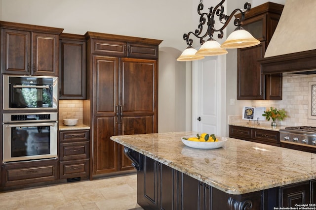 3919 El Chamizal, San Antonio, TX 78261 - kitchen featuring stainless steel appliances, light stone counters, backsplash, and premium range hood