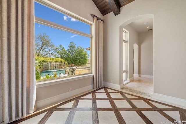 3919 El Chamizal, San Antonio, TX 78261 - spare room featuring arched walkways, baseboards, and a wealth of natural light