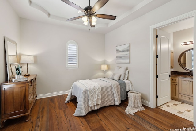 3919 El Chamizal, San Antonio, TX 78261 - bedroom with a raised ceiling, baseboards, and wood finished floors