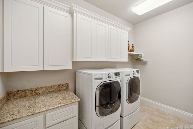 3919 El Chamizal, San Antonio, TX 78261 - laundry area with washing machine and clothes dryer, cabinet space, and baseboards