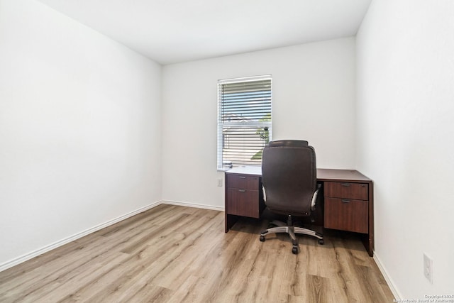 office with baseboards and light wood finished floors