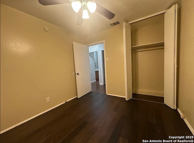 4223 Redstone Dr, San Antonio, TX 78219 - unfurnished bedroom featuring a closet, dark wood finished floors, baseboards, visible vents, and ceiling fan