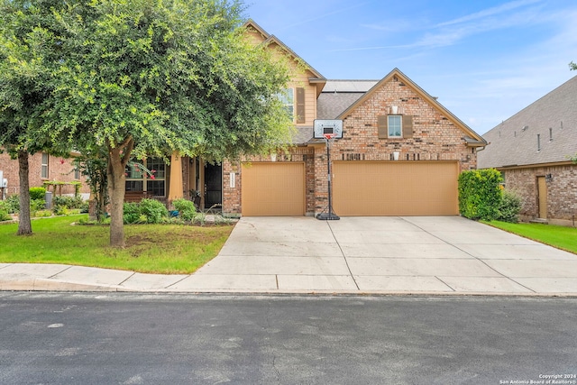 11331 Phoebe Lace, San Antonio, TX 78253 - view of front of home featuring an attached garage, concrete driveway, a front yard, and brick siding