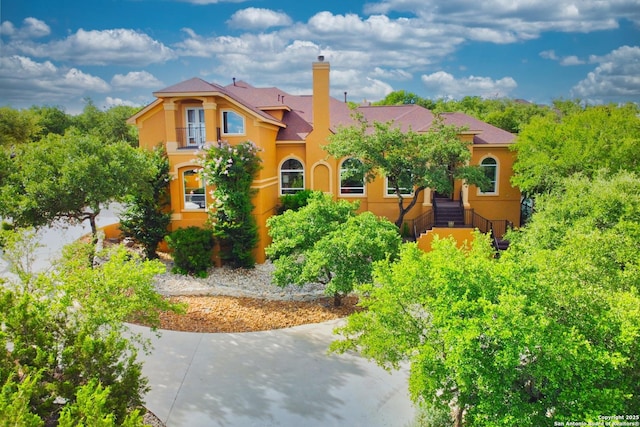 2110 Winding Vw, San Antonio, TX 78260 - view of front of house with stucco siding and a chimney