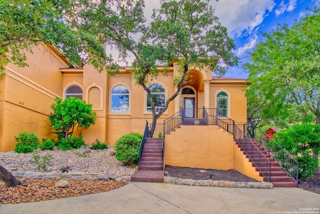 2110 Winding Vw, San Antonio, TX 78260 - view of front of property with stucco siding and stairs