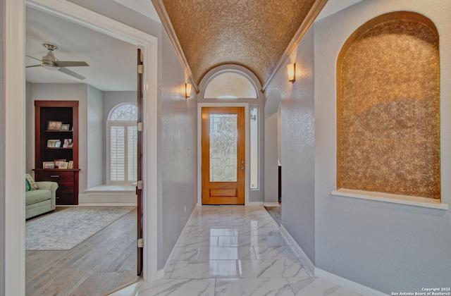 2110 Winding Vw, San Antonio, TX 78260 - entrance foyer with baseboards, marble finish floor, ceiling fan, and crown molding