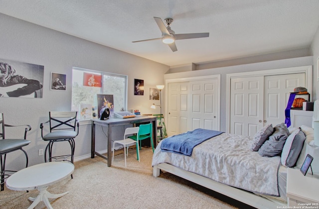 2110 Winding Vw, San Antonio, TX 78260 - carpeted bedroom featuring baseboards, a textured ceiling, a textured wall, and ceiling fan
