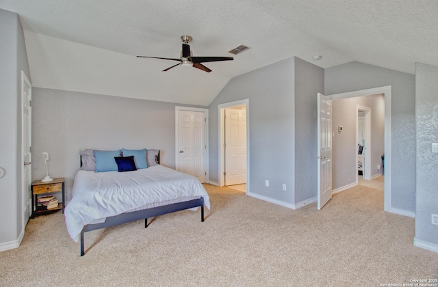 2110 Winding Vw, San Antonio, TX 78260 - bedroom with vaulted ceiling, a textured ceiling, baseboards, visible vents, and ceiling fan