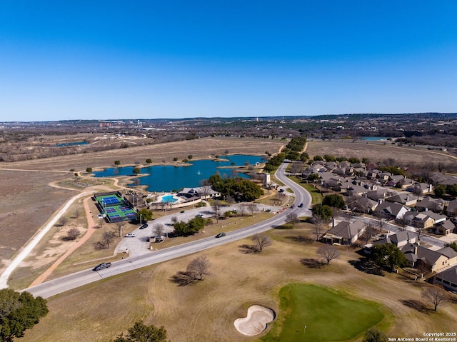 birds eye view of property with a residential view, a water view, and golf course view