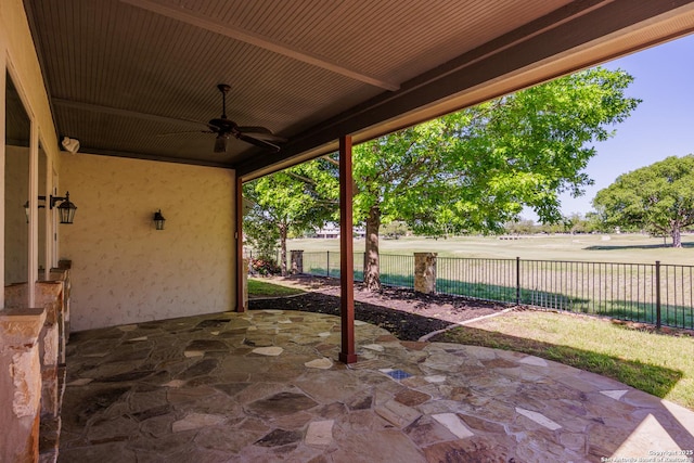 view of patio / terrace featuring fence and a ceiling fan