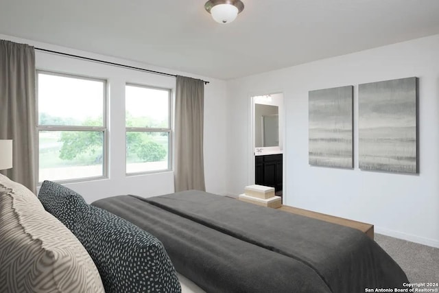 carpeted bedroom with baseboards