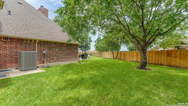view of yard featuring cooling unit and a fenced backyard